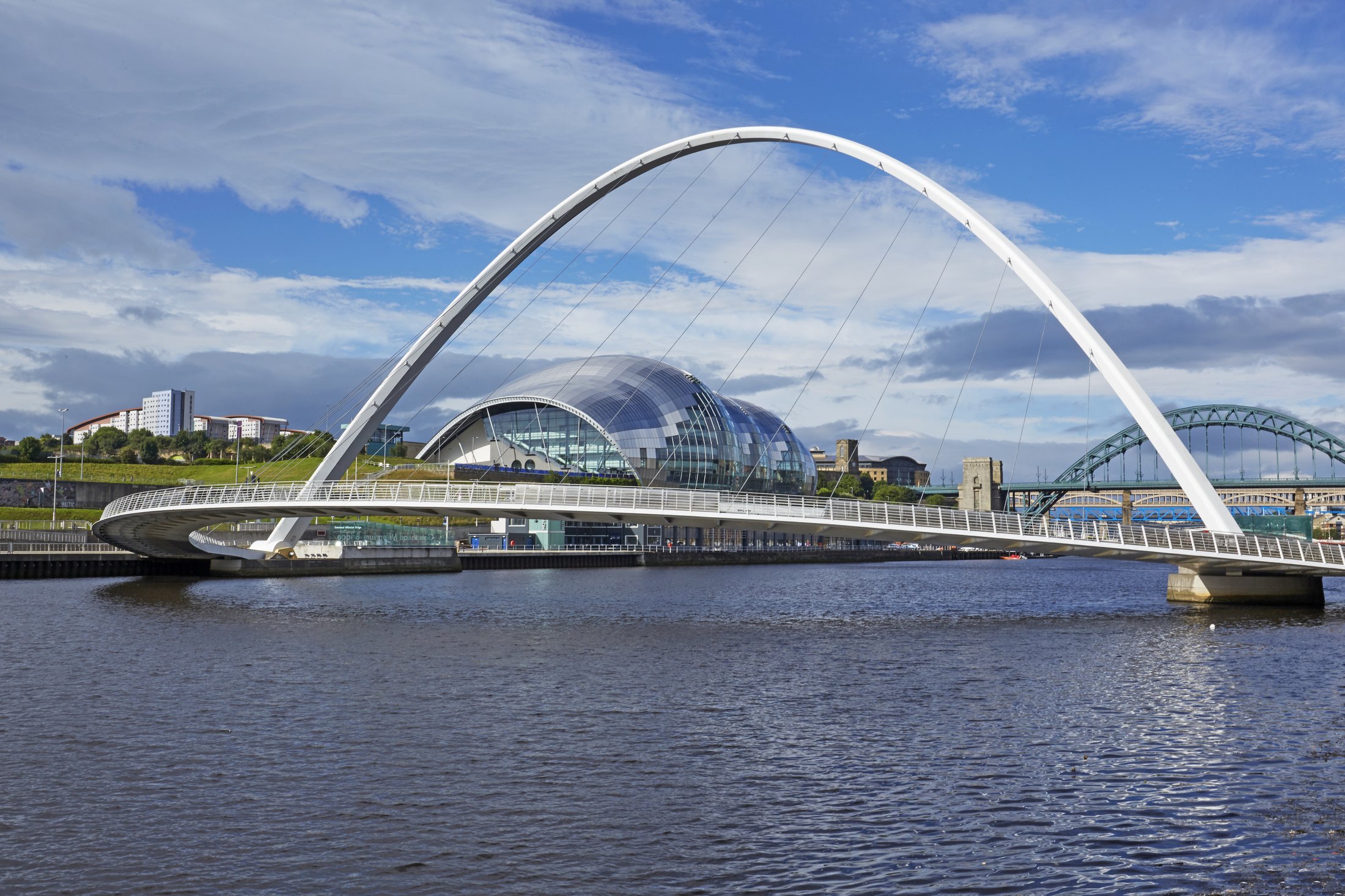 The Gateshead Millennium Bridge, with Sage Gateshead and the Tyne Bridge behind